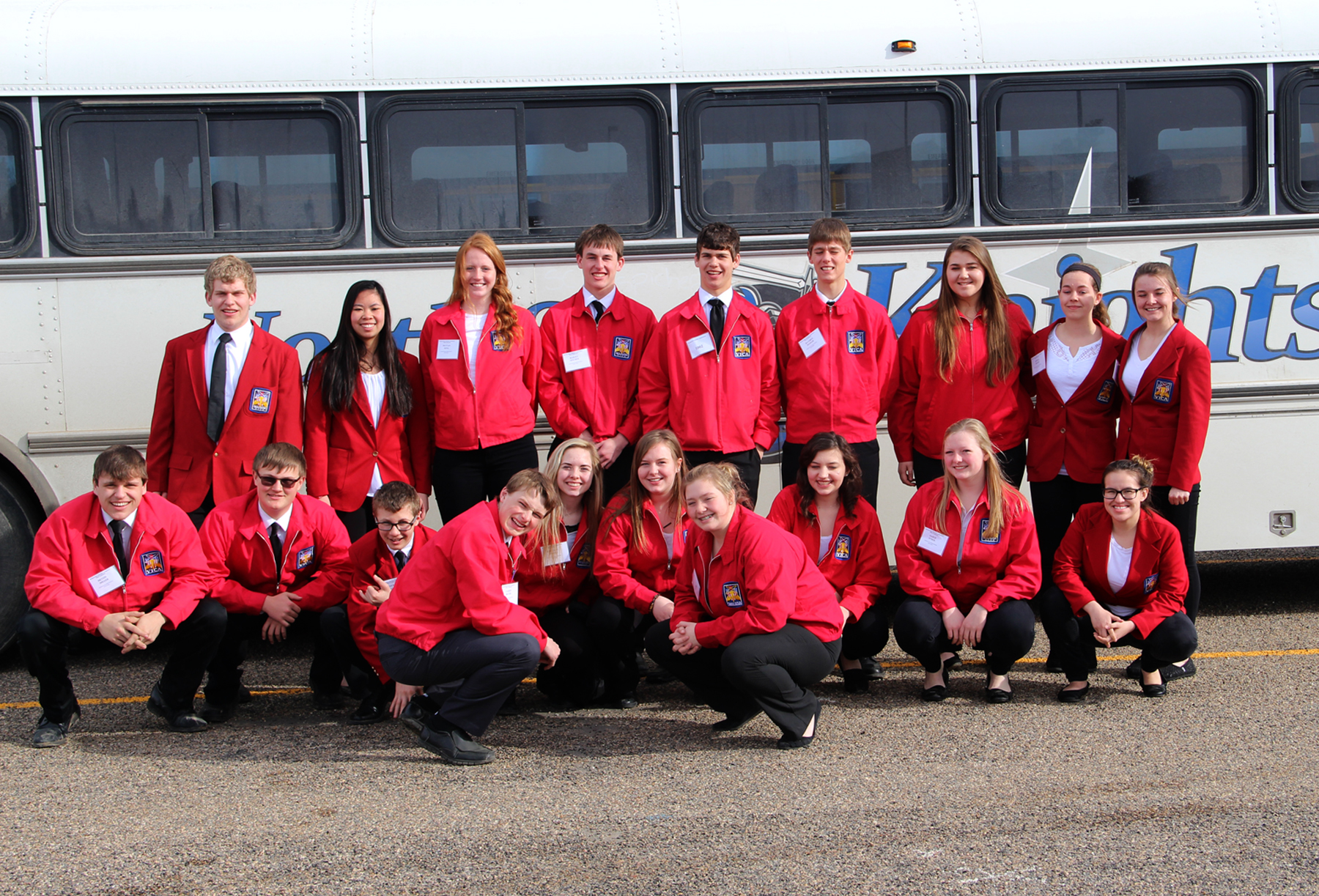 Skill USA team picture in front of bus